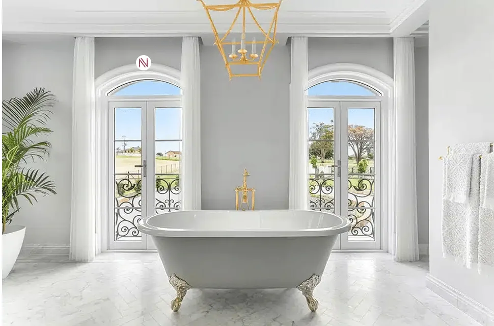 French Provincial bathroom design featuring curved architraves around double patio doors