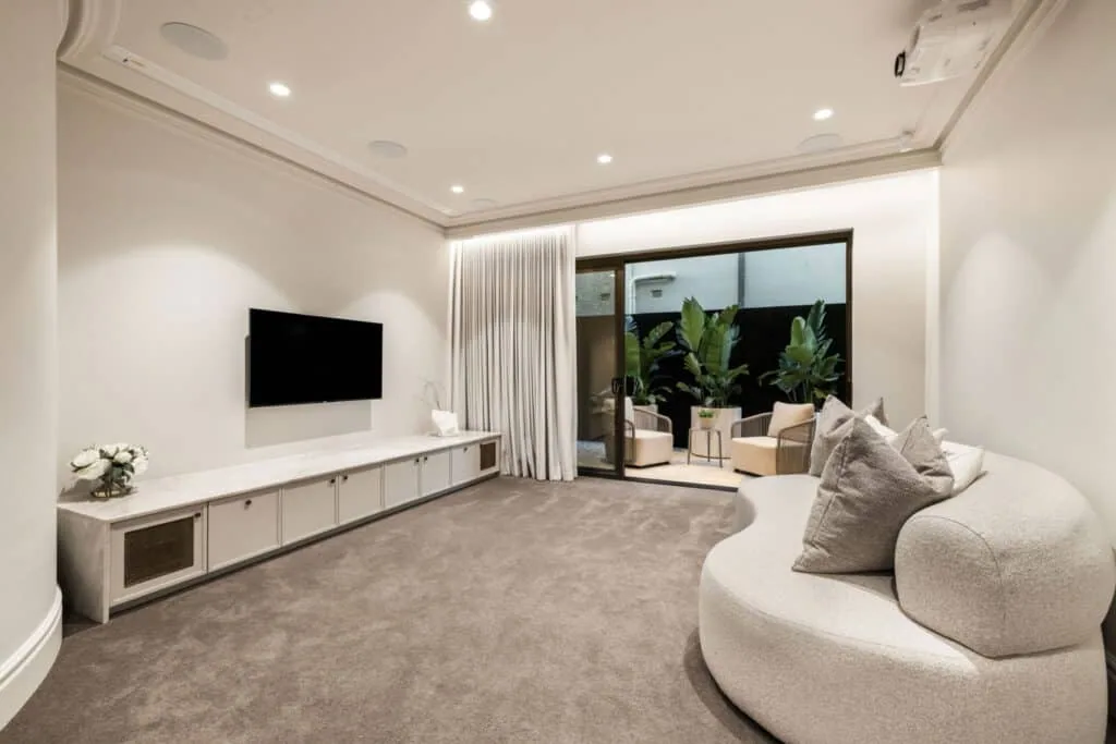 Contemporary minimalist room with natural light, smooth wall finishes, and Intrim skirting boards enhancing the space.
