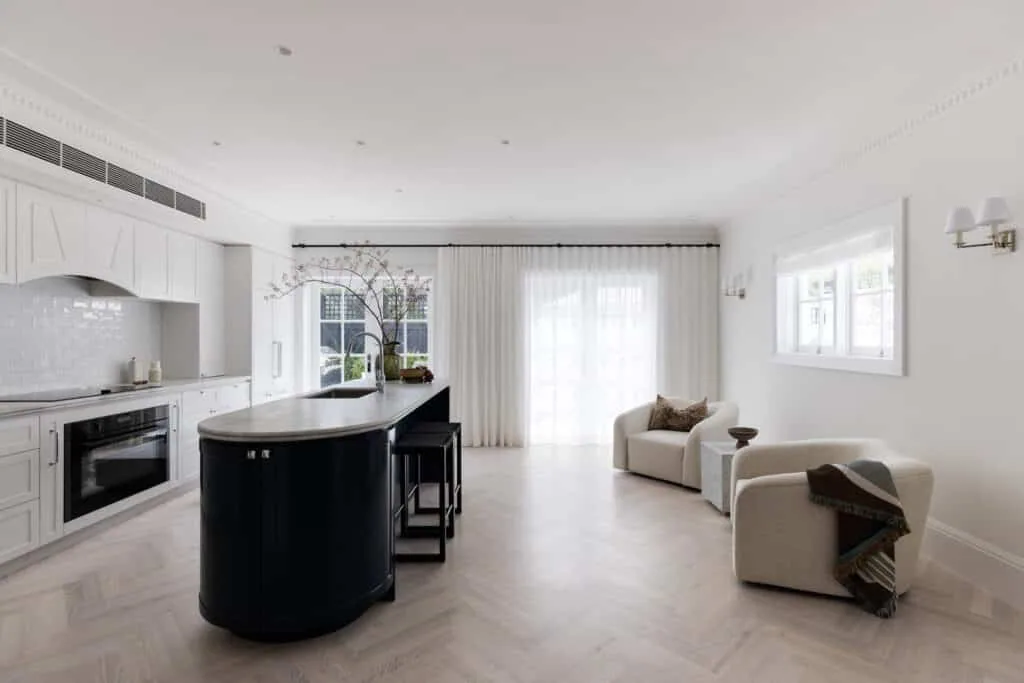 Coastal minimalist interior with natural timber tones, white walls, and Intrim skirting boards for a refined finish.