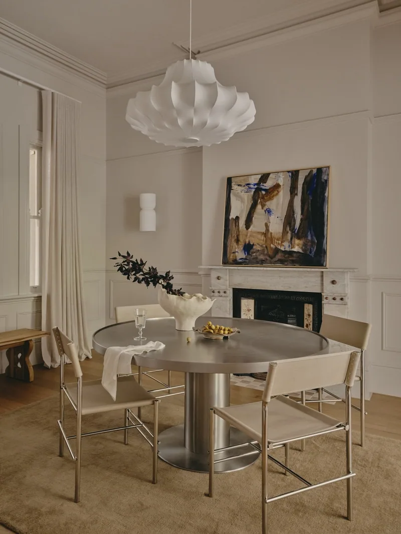 Dining room with fireplace and wall panelling in Potts Point terrace renovation by Convict Interiors using Intrim mouldings