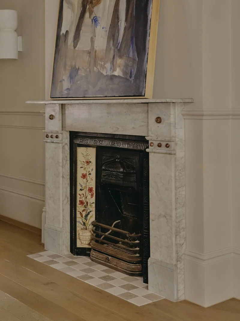 Original marble fireplace with decorative wall panelling in Victorian terrace renovation by Convict Interiors featuring Intrim profiles