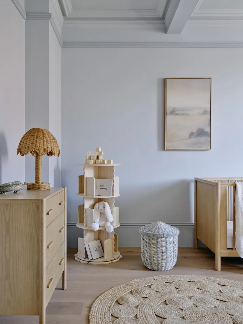 Nursery corner with oak furniture and wall mouldings in Potts Point terrace renovation by Convict Interiors using Intrim profiles