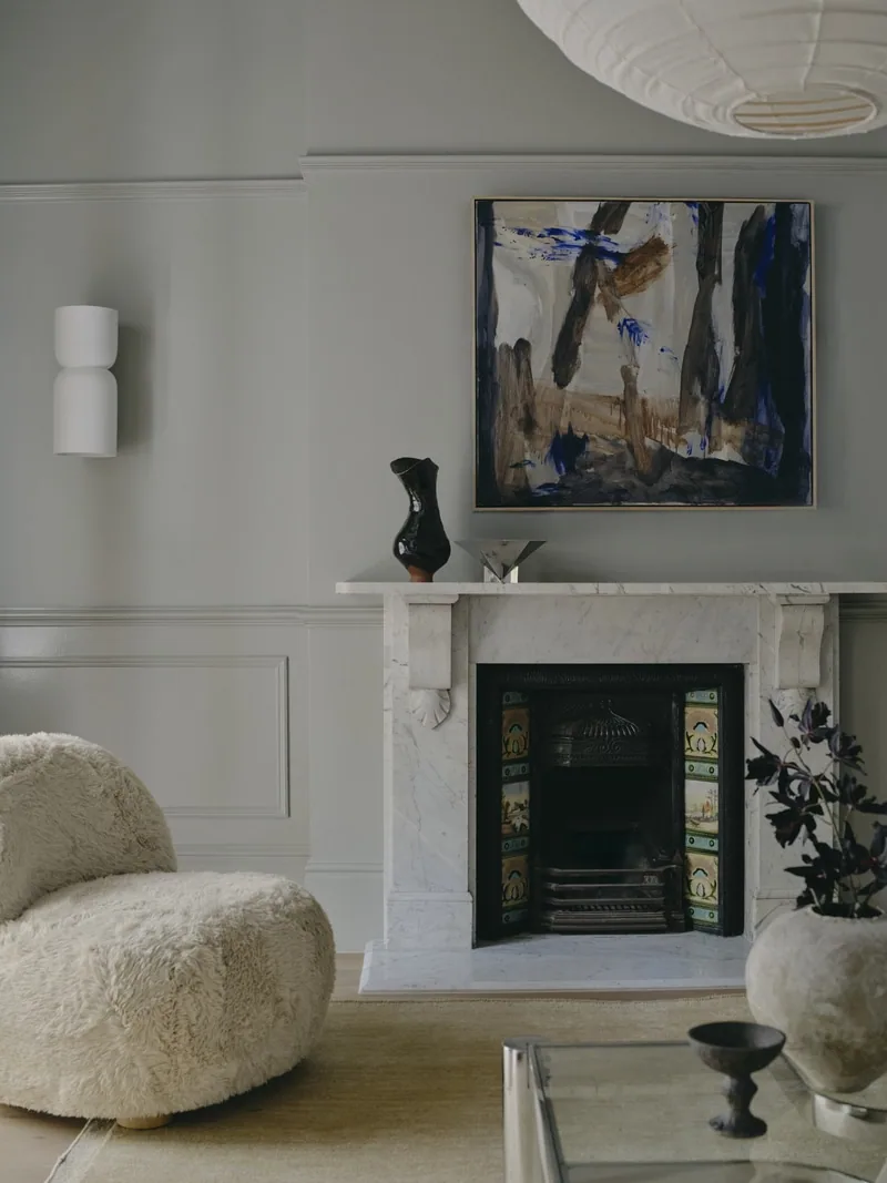 Fireplace focal point with art and panelling in Victorian terrace Potts Point renovation by Convict Interiors using Intrim skirting, chair rail, inlay mould, picture rail profiles.