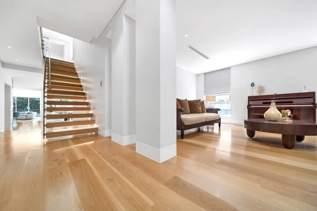 Bright minimalist interior with natural light, smooth wall finishes, and Intrim skirting boards creating a clean, modern look.